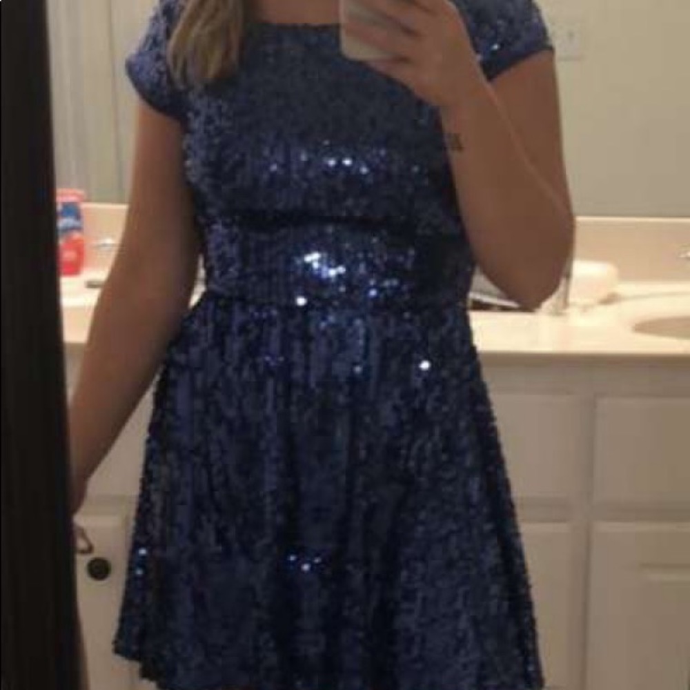 Never worn without tags , sequin and blue